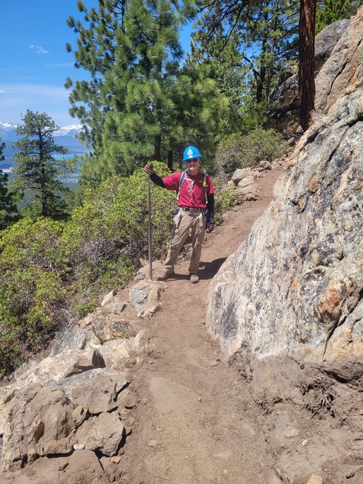 TRTA Volunteer stands proudly as sections of the trail at Castle Rock are resized and restructured to better protect the Peregrine Falcon.